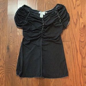Black and white polkadot top with tags